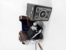 Parti gamla kameror, kikare